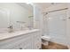 Well-lit bathroom featuring double sinks with updated fixtures, a shower-tub combination, and neutral tile flooring at 4032 S Santa Rita Pl, Chandler, AZ 85249