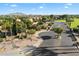 Scenic view of Quail Springs neighborhood featuring palm trees and lush landscaping, creating a tranquil environment at 4032 S Santa Rita Pl, Chandler, AZ 85249