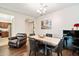 Charming dining room with wood floors, stylish marble table with seating for six, and elegant decor at 4032 S Santa Rita Pl, Chandler, AZ 85249