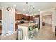 Well-lit kitchen with a granite countertop island, stainless steel appliances, and ample cabinet space at 4032 S Santa Rita Pl, Chandler, AZ 85249