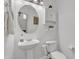 Charming powder room features a pedestal sink and decorative mirror at 4159 E Jasper Dr, Gilbert, AZ 85296