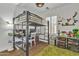 Bedroom with a lofted bed, desk area, wood floors and shelving, and a ceiling fan at 4159 E Jasper Dr, Gilbert, AZ 85296