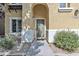 Inviting front entryway with an arched doorway, stone accents, and well-kept landscaping at 4159 E Jasper Dr, Gilbert, AZ 85296