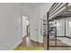Hallway leading to a bedroom with a loft bed, desk area, and mirrored closet at 4159 E Jasper Dr, Gilbert, AZ 85296