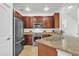 Modern kitchen boasts stainless steel appliances, granite countertops, and ample cabinet space at 4159 E Jasper Dr, Gilbert, AZ 85296