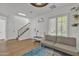 Neutral Living Room with hardwood floors, gray futon, and lots of natural light at 4159 E Jasper Dr, Gilbert, AZ 85296
