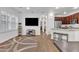 Bright open-concept living space features stylish décor, a modern kitchen, and hardwood flooring at 4159 E Jasper Dr, Gilbert, AZ 85296