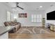 Spacious living area with a hardwood floor, a ceiling fan, and recessed lighting at 4159 E Jasper Dr, Gilbert, AZ 85296
