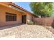 A cozy covered patio with stone ground and a view of the backyard at 43875 W Baker Dr, Maricopa, AZ 85138