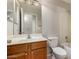 Bathroom featuring a vanity with sink, toilet, and shower at 43875 W Baker Dr, Maricopa, AZ 85138