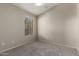 Comfortable bedroom with plush carpeting and neutral walls at 43875 W Baker Dr, Maricopa, AZ 85138