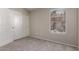 Cozy bedroom featuring carpet, closet and a window at 43875 W Baker Dr, Maricopa, AZ 85138