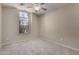 Bright bedroom with a window at 43875 W Baker Dr, Maricopa, AZ 85138