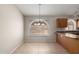 Inviting dining area featuring tile floors and a window with natural light at 43875 W Baker Dr, Maricopa, AZ 85138