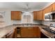 Close up of the kitchen with stainless steel appliances and granite countertops at 43875 W Baker Dr, Maricopa, AZ 85138