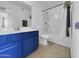 This bathroom features an updated vanity, a large mirror and a shower/tub combo with tile flooring at 4416 E Riverside St, Phoenix, AZ 85040