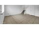 Spacious living area with tile flooring, leading to carpeted stairs and upstairs area at 4416 E Riverside St, Phoenix, AZ 85040