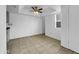 Light-filled living area with ceiling fan and tile flooring throughout, offering easy maintenance at 4416 E Riverside St, Phoenix, AZ 85040
