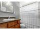 A cozy full bathroom with a single sink, toilet, and shower with shower curtain at 4515 N 26Th Dr, Phoenix, AZ 85017