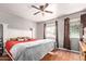 Bright bedroom with neutral walls, hardwood flooring, and a comfortable bed setup at 4515 N 26Th Dr, Phoenix, AZ 85017