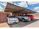Three cars parked under a sturdy carport structure on a sunny day at 4515 N 26Th Dr, Phoenix, AZ 85017