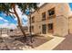 Charming two-story exterior with desert landscaping, a mature tree, and wrought iron accents at 4515 N 26Th Dr, Phoenix, AZ 85017