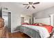 This primary bedroom boasts ample space, neutral walls, a ceiling fan, and an ensuite bathroom at 4515 N 26Th Dr, Phoenix, AZ 85017