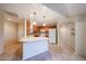 Bright eat-in kitchen with tile floors, central island, wood cabinets and modern appliances at 5249 E Shea Blvd # 215, Scottsdale, AZ 85254