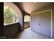 Enclosed patio area with storage closet and views of tree at 5249 E Shea Blvd # 215, Scottsdale, AZ 85254
