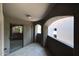 Enclosed patio area with sliding glass doors and archway at 5249 E Shea Blvd # 215, Scottsdale, AZ 85254