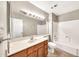 Bathroom featuring a single vanity, shower-tub combo and tile floor at 540 N May St # 1109, Mesa, AZ 85201