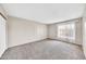 Sunlit bedroom with a large window and neutral colored walls at 540 N May St # 1109, Mesa, AZ 85201