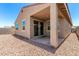 View of covered patio with sliding glass doors to the home at 5626 W Rainwater Dr, Laveen, AZ 85339