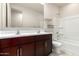 Bathroom features a double sink vanity, bathtub, and toilet at 5626 W Rainwater Dr, Laveen, AZ 85339
