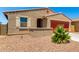 Charming single-story home featuring a covered porch and a neutral stucco facade at 5626 W Rainwater Dr, Laveen, AZ 85339