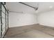 Spacious two car garage with concrete flooring and automatic door at 5626 W Rainwater Dr, Laveen, AZ 85339