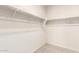 Organized walk-in closet with ample shelving and hanging space, providing plenty of storage at 5626 W Rainwater Dr, Laveen, AZ 85339