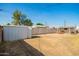 Fenced in backyard with storage shed at 62 W Beall Ave, Mesa, AZ 85210