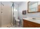 Bathroom with walk-in shower, vanity with sink, and a tile floor at 62 W Beall Ave, Mesa, AZ 85210