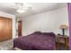 Cozy bedroom featuring a ceiling fan, plush carpeting, and neutral paint at 62 W Beall Ave, Mesa, AZ 85210