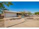 Single story house with a two car garage, fenced in yard, and a concrete driveway at 62 W Beall Ave, Mesa, AZ 85210