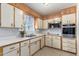The kitchen features white cabinets, modern appliances, and ample counter space at 62 W Beall Ave, Mesa, AZ 85210