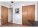 Office space with ceiling fan, built-in cabinets, and access to another room at 62 W Beall Ave, Mesa, AZ 85210