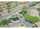 An aerial view that showcases the lush landscaping, ponds, and serene streets within the community at 705 W Queen Creek Rd # 1201, Chandler, AZ 85248