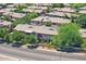 Expansive aerial view of condos with beige exteriors, complemented by lush greenery and well-maintained landscaping at 705 W Queen Creek Rd # 1201, Chandler, AZ 85248