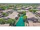 Aerial view of beautiful condos surrounding a canal that flows through the community at 705 W Queen Creek Rd # 1201, Chandler, AZ 85248