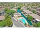 Community featuring a waterway, a pool, and desert landscaping at 705 W Queen Creek Rd # 1201, Chandler, AZ 85248