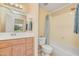 Bathroom features a vanity with an integrated sink and a tub and shower combo at 705 W Queen Creek Rd # 1201, Chandler, AZ 85248