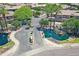 Community entrance with ponds, mature landscaping, and a decorative gate at 705 W Queen Creek Rd # 1201, Chandler, AZ 85248