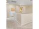 Spacious hallway with carpet flooring, natural light, and laundry area at 705 W Queen Creek Rd # 1201, Chandler, AZ 85248